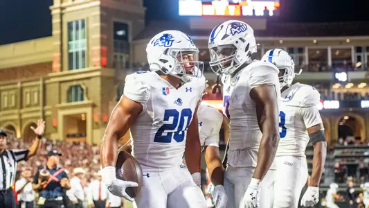 Nehemiah Martinez celebrates after scoring a touchdown against Texas Tech