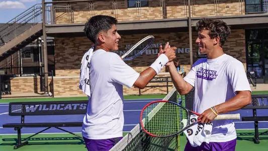 Luis Jose Nakamine and Ethan Scribner hug during a practice on September 30, 2025