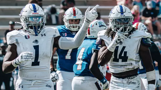 Will Shaffer and Rashon Myles, Jr. between plays at West Georgia