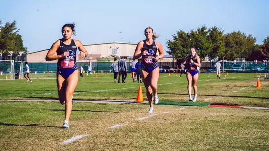 ACU's Alyssa Quinones, Madison Anderson, and Kyla Fuller run in the 2025 WAC Cross Country Championships