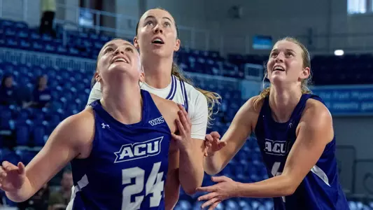 Emma Troxell and Erin Woodson battle for a rebound in ACU's 62-59 loss to Northwestern in Fort Myers, Fla. on Nov. 28, 2025.