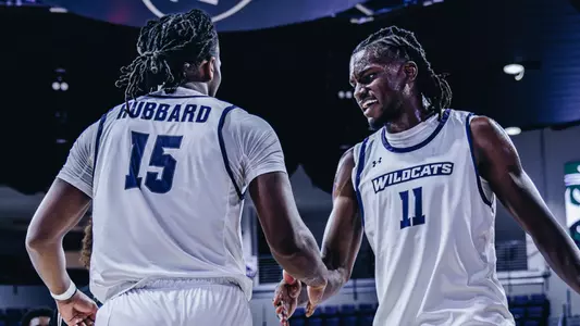 Ma'Shy Hill and Bradyn Hubbard slap hands during a game versus McMurry on November 3, 2025