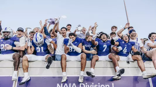 ACU football players celebrate in the stands with students after beating Tarleton State on November 1, 2025