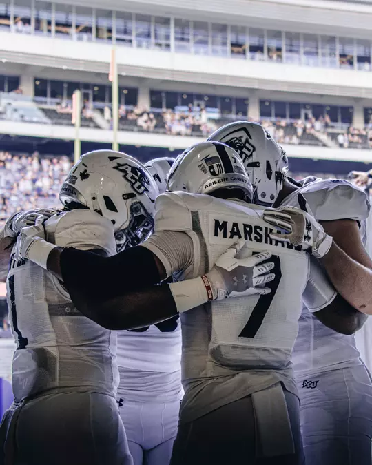 T.J. Marshall huddles in prayer with his fellow team captains before playing TCU on Sept. 13, 2025