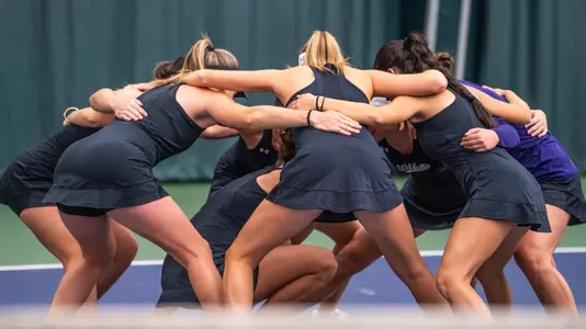 The ACU women's tennis team huddles during its match versus New Mexico at the Teague Center on Feb. 21, 2025.