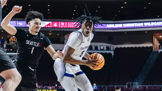 Quion Williams tries to drive against Seattle U in the WAC Tournament quarterfinals on March 13, 2025