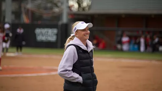 ACU softball head coach Jo Koons smiles during a game at Seattle U.