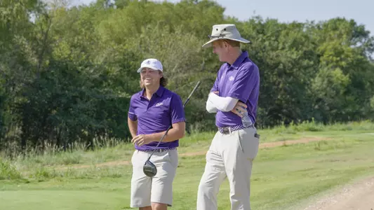 Jaime Lewis and coach Tom Shaw talk at the Trinity Forest Invitational at Trinity Forest Golf Club on Oct. 6-8, 2024.