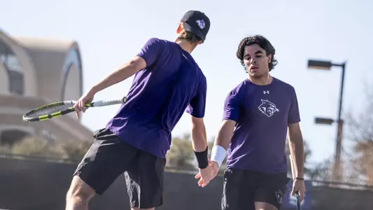 Matheus Lima and Tomas Tischner celebrate in ACU men's tennis' match versus Texas A&M-Texarkana at the Judi and Cecil Eager Tennis Pavilion on March 1, 2025.