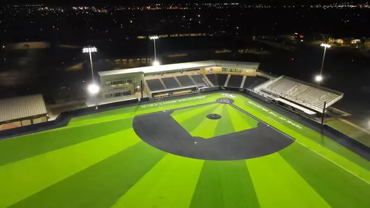 Night time drone shot of Crutcher Scott Field at Bullock Brothers Ballpark