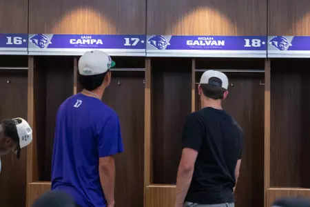 Players look at their new lockers in the McCaleb and Miller Team Room.