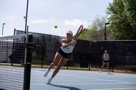 Masha Vrsalovic stretches for a ball during ACU's quarterfinal match of the WAC Team Tennis