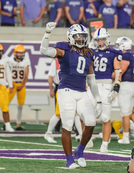 Darius Moore signals third down in a game vs Northern Colorado on August 31, 2023