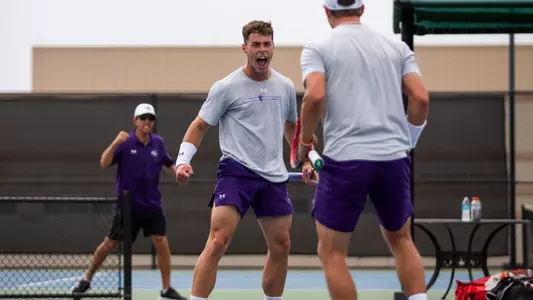 Ethan Scribner yells in excitement during a doubles match at the 2025 WAC Team Tennis Championship