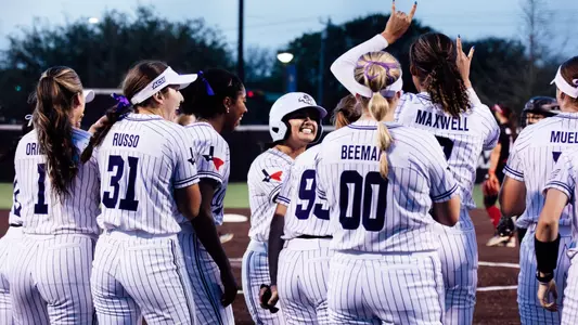 ACU softball players celebrate with Miranda Lista after a home run on April 2, 2025