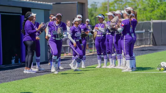 Mckenley Clark runs onto the field after high fives with teammates on May 3, 2025