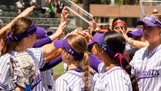 ACU softball players huddle up during their WAC Tournament game on May 7, 2025