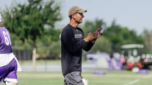 Graham Harrell coaches during a practice on July 31, 2025
