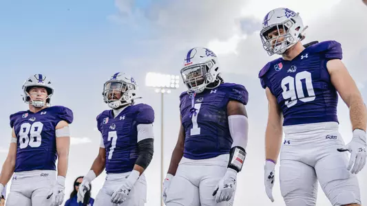 ACU football team captains T.J. Marshall, Will Shaffer, Jed Castles and Kaghen Roach gather for the coin toss against Austin Peay on Sept. 20, 2025