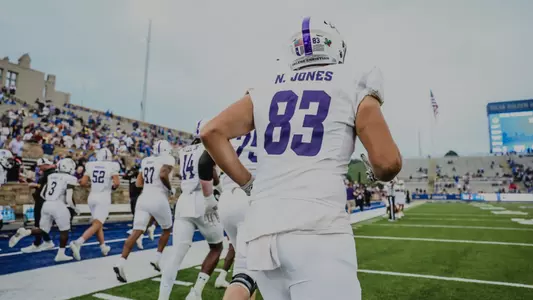 Nathan Jones runs onto the field before ACU's game at Tulsa on August 30, 2025