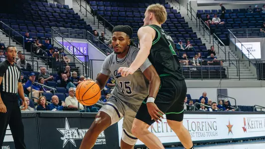 Bradyn Hubbard drives by a Utah Valley player on January 3, 2026