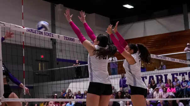 Aubrey Beaver and Hannah Gonzalez attempt to block an attack in ACU's matchup with Tarleton State in Stephenville, Texas on Oct. 10, 2026.