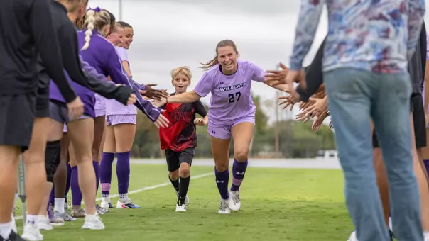 Gracie Kelly runs through the pregame tunnel before ACU's matchup with Central Arkansas at Elmer Gray Stadium on Oct. 4, 2026.