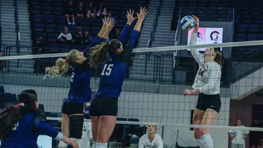 Avery Thaler and Hadlee Welch attempt to block an attack in ACU's 3-1 win over Little Rock at Moody Coliseum on Oct. 3, 2026.
