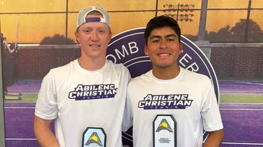 Gus Tettamble and Luis Jose Nakamine smile with their doubles championship trophies at the ASUN Individual Tournament on Oct. 24, 2026