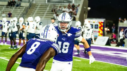 Seth Weller celebrates with Keonde Henry after a play against West Florida on Oct. 3, 2026.