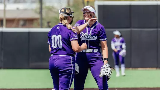 Elizabeth Schaefer celebrates with Ella Beeman during a 2025 game