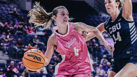 Erin Woodson dribbles around a defender in ACU's matchup with California Baptist at Moody Coliseum on Feb. 7, 2026.