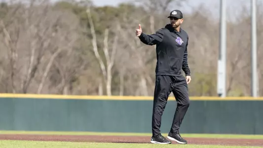 Rick McCarty gives a thumbs up during a road practice in 2025.