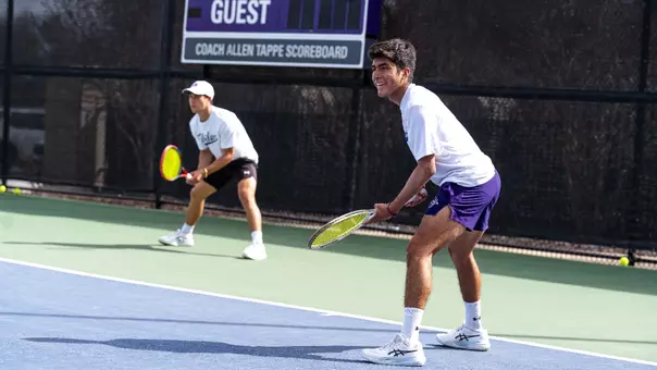 Luis Jose Nakamine and Ethan Scribner prepare for their doubles point.