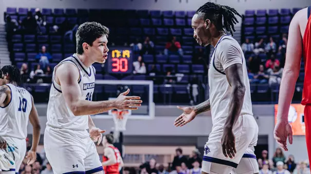 Isaac Dye gives support to teammate Cbo Newton during a home game vs Utah Tech on January 29, 2026