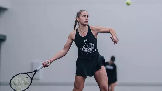 Maria Cascos returns a ball to her opponent.