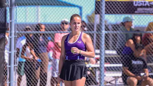 Maria Cascos prepares to hit her serve against New Mexico State on March 1.