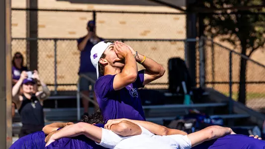 ACU men's tennis team huddles before a match against Lamar on February 28, 2026