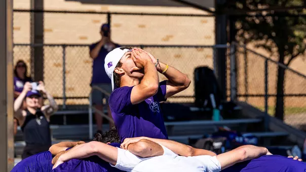 ACU men's tennis team huddles before a match against Lamar on February 28, 2026