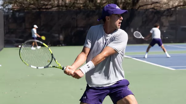 Tomas Quesada sends a ball over the net in his match on February 26 against Wichita State.