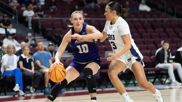 Payton Hull drives in against a California Baptist defender during the 2026 WAC Tournament championship game on March 14, 2026