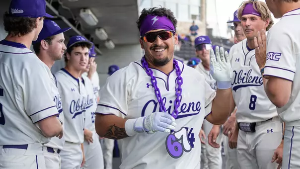 Diego Cardenas smiles after getting high-fives from teammates during a game against LMU on March 14, 2026