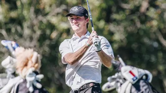 Tres Hill watches his ball at an ACU men's golf practice in Abilene, Texas on Sept. 11, 2025.