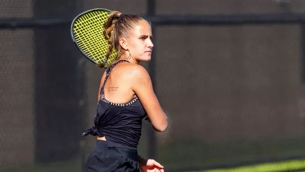 Maria Cascos watches as her opponent returns the ball.