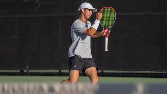 Ethan Scribner celebrates a point in a match on March 21, 2026 against Hardin-Simmons.