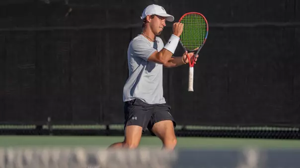 Ethan Scribner celebrates a point in a match on March 21, 2026 against Hardin-Simmons.