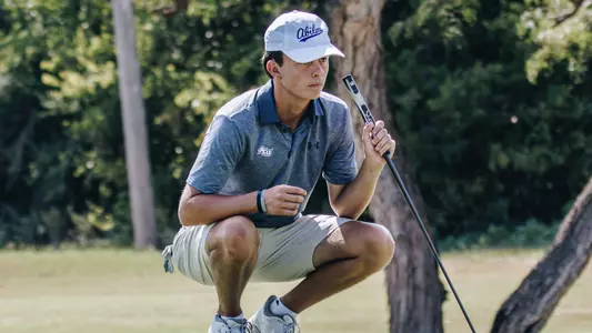 Jack Hollingsed examines a putt at an ACU men's golf practice at Abilene Country Club on Sept. 11, 2025.