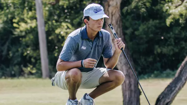 Jack Hollingsed examines a putt at an ACU men's golf practice at Abilene Country Club on Sept. 11, 2025.
