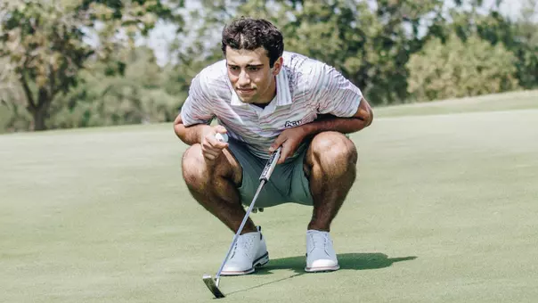Grégoire Hoyeau examines a putt at an ACU men's golf practice at Abilene Country Club on Sept. 11, 2025.