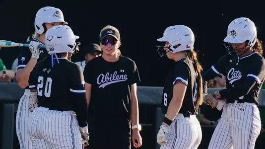 ACU softball coach Jo Koons talks with players during a game at North Texas on March 25, 2026